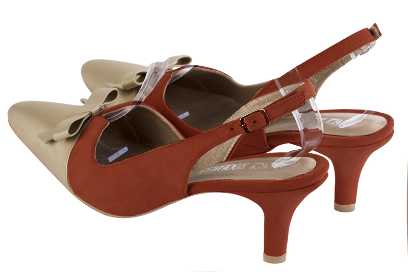 Gold and terracotta orange women's open back shoes, with a knot. Tapered toe. Medium slim heel. Rear view - Florence KOOIJMAN